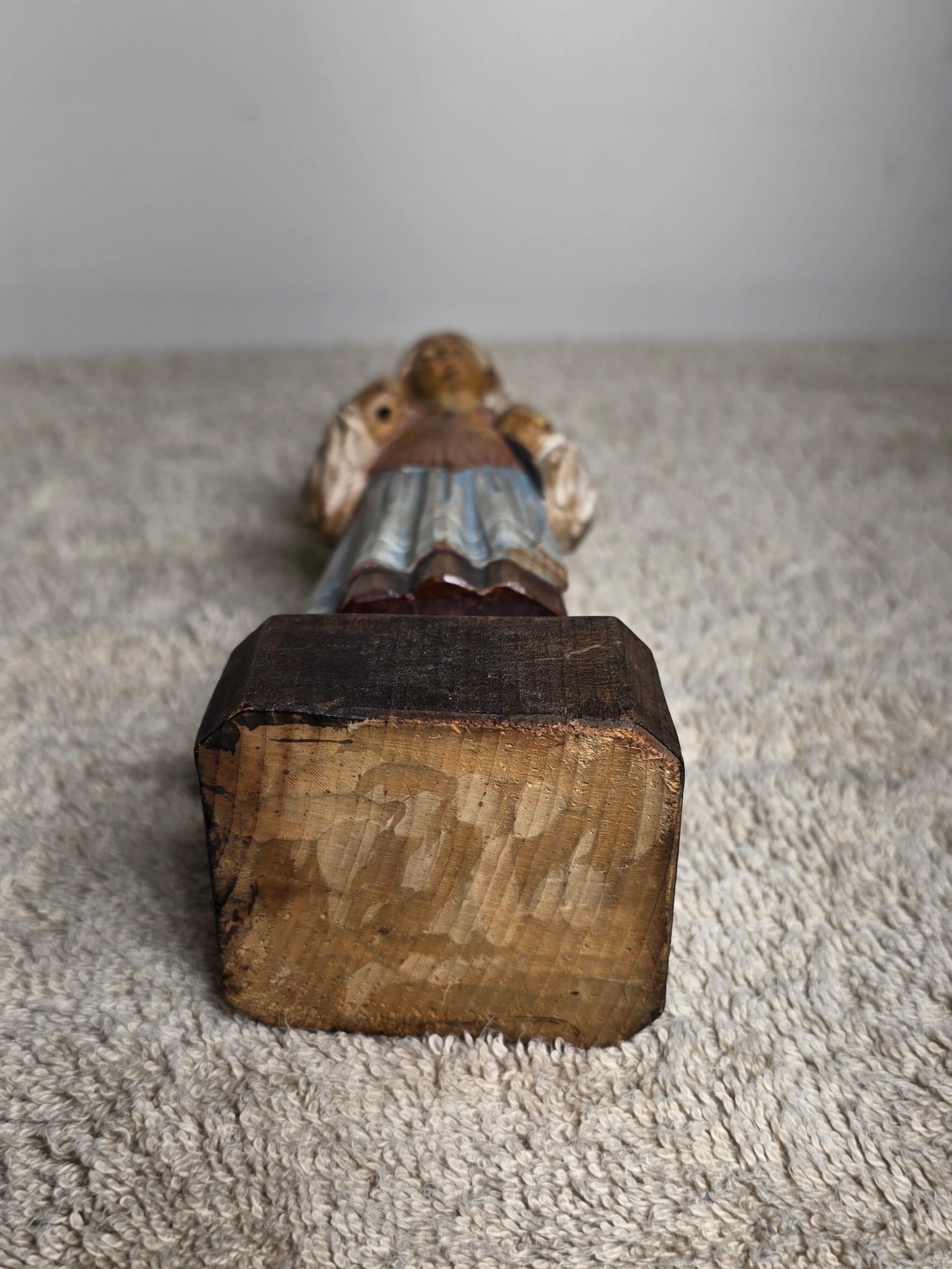 Vintage folk art wood carving of a woman