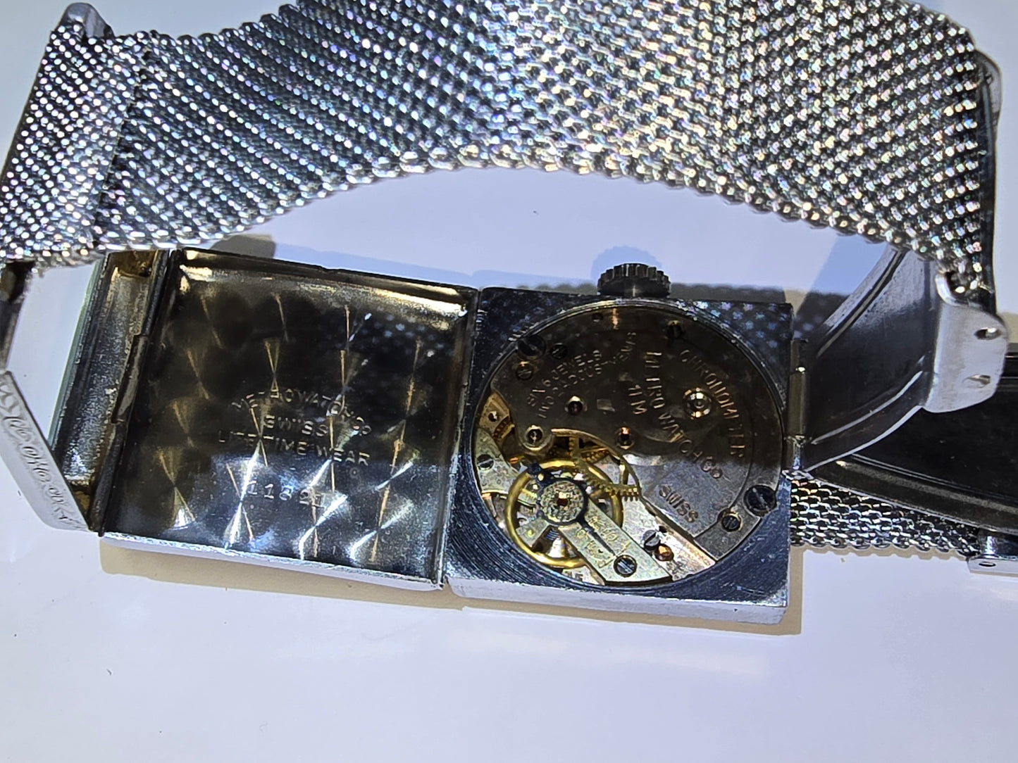 Vintage art deco Metro square hooded engraved case wristwatch. 1930's