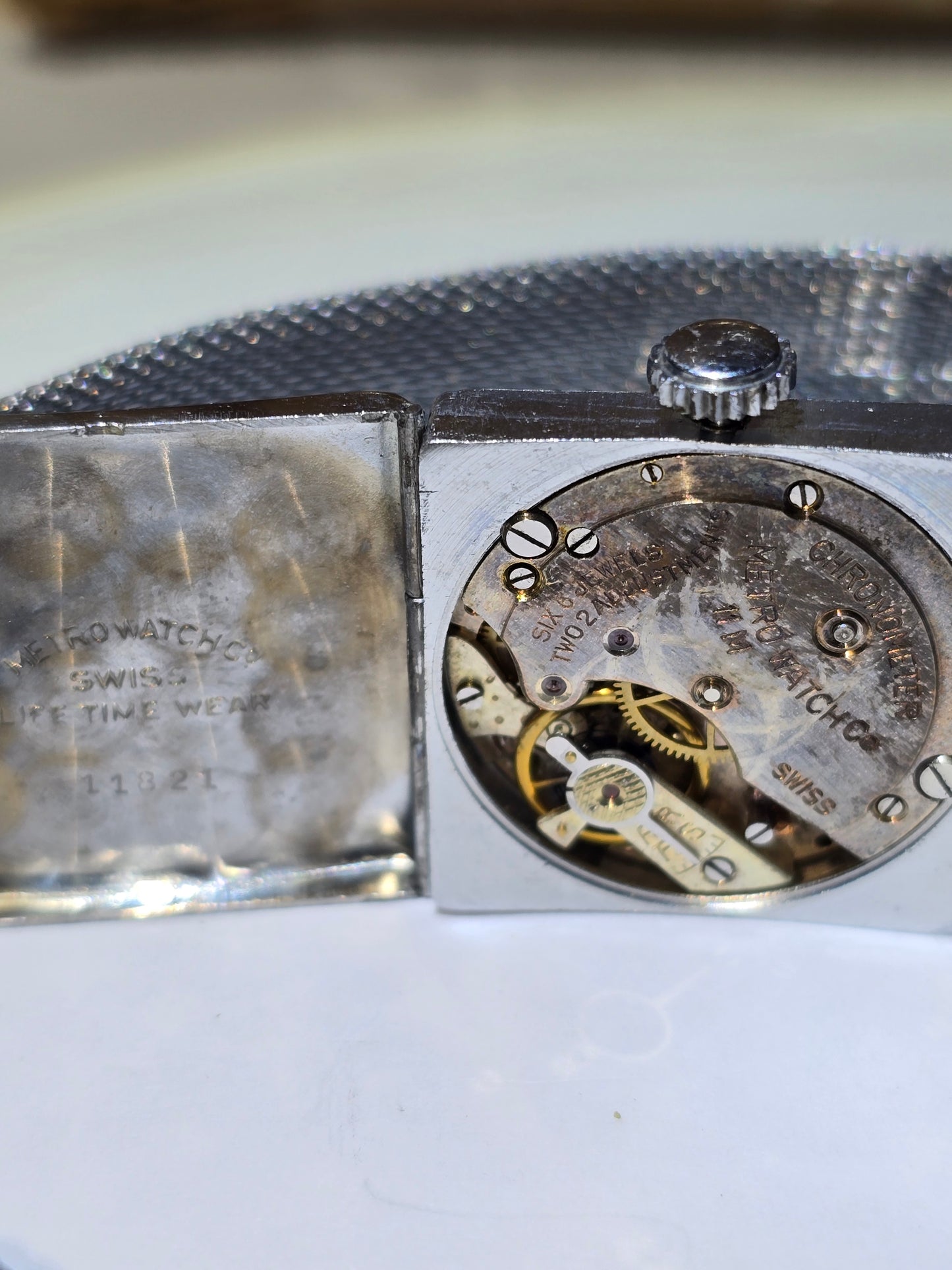 Vintage art deco Metro square hooded engraved case wristwatch. 1930's