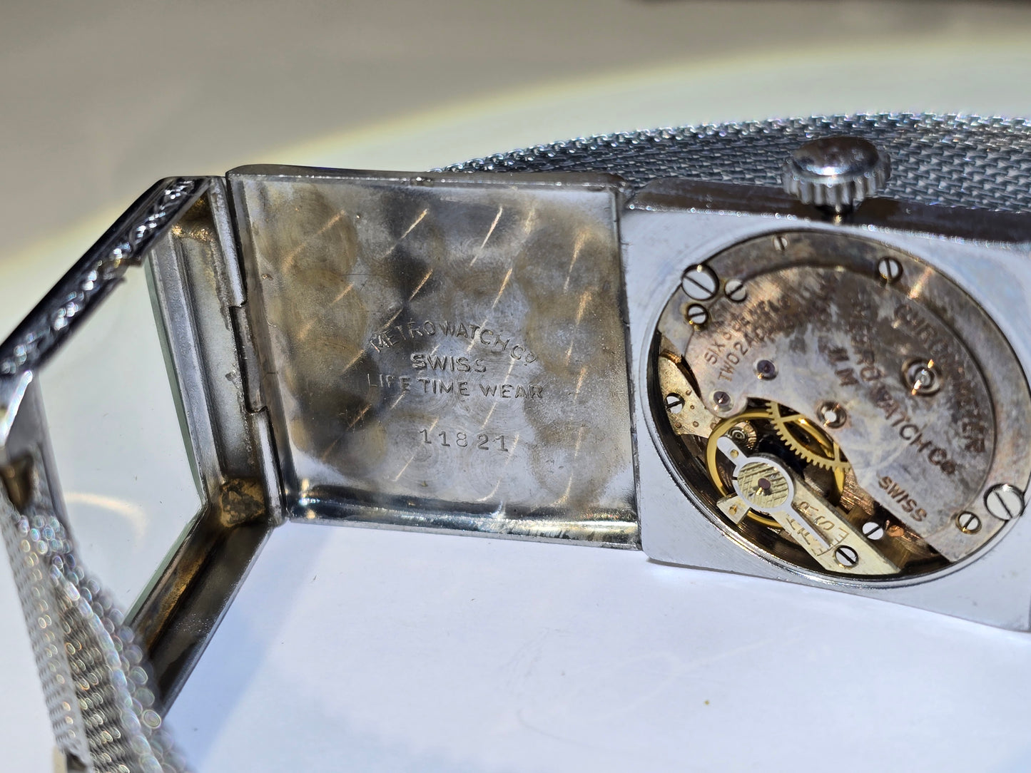 Vintage art deco Metro square hooded engraved case wristwatch. 1930's