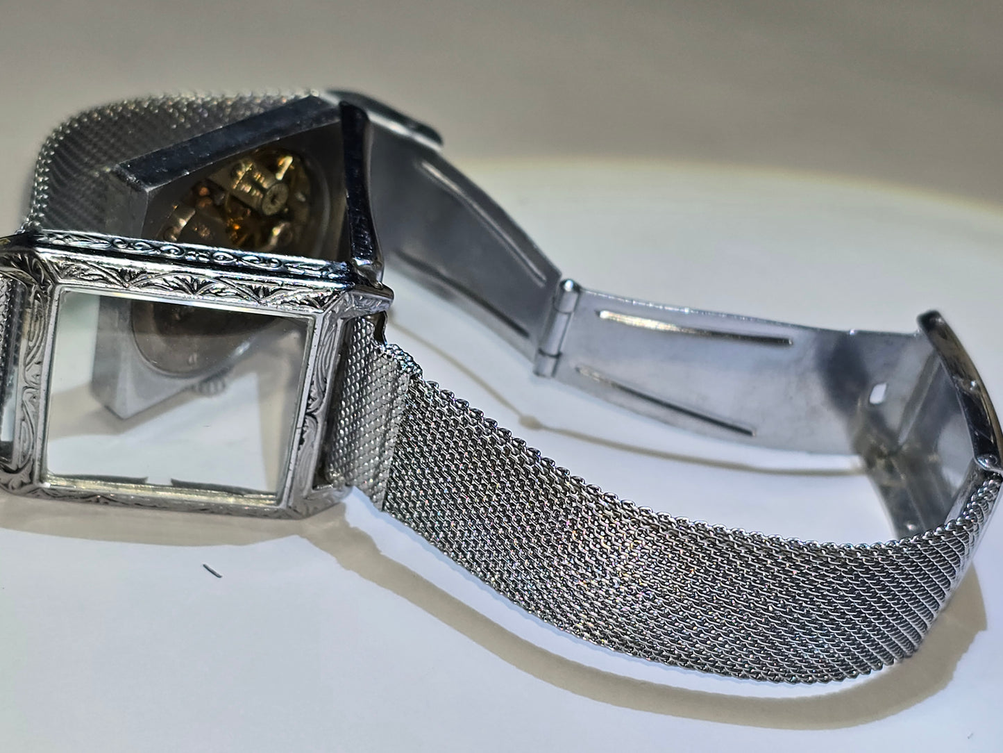 Vintage art deco Metro square hooded engraved case wristwatch. 1930's