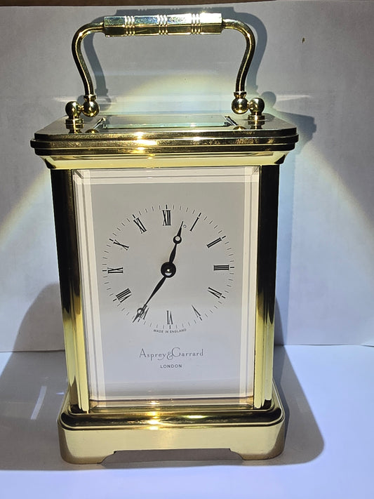 Asprey and Garrard brass cased carriage clock