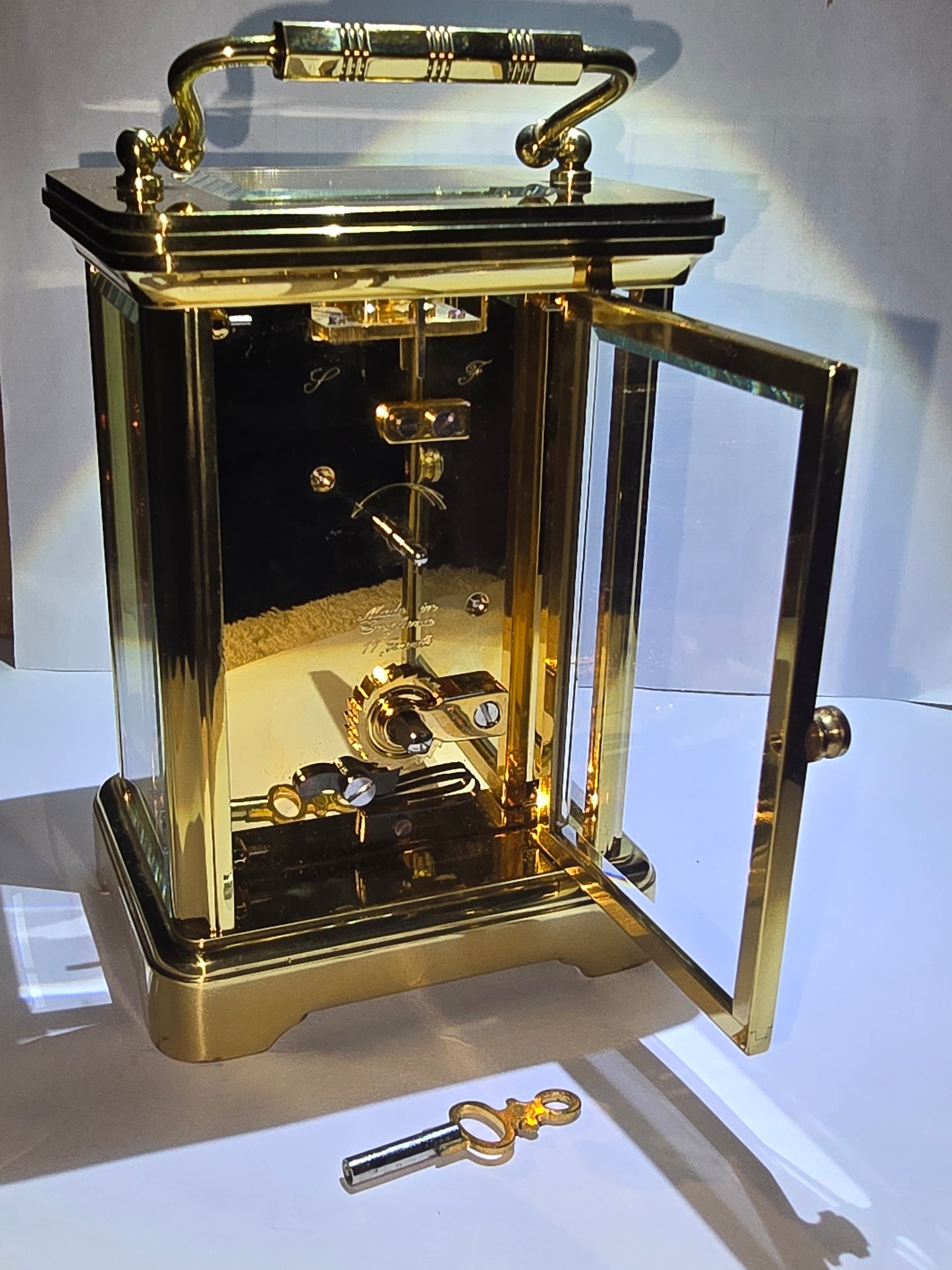 Asprey and Garrard brass cased carriage clock