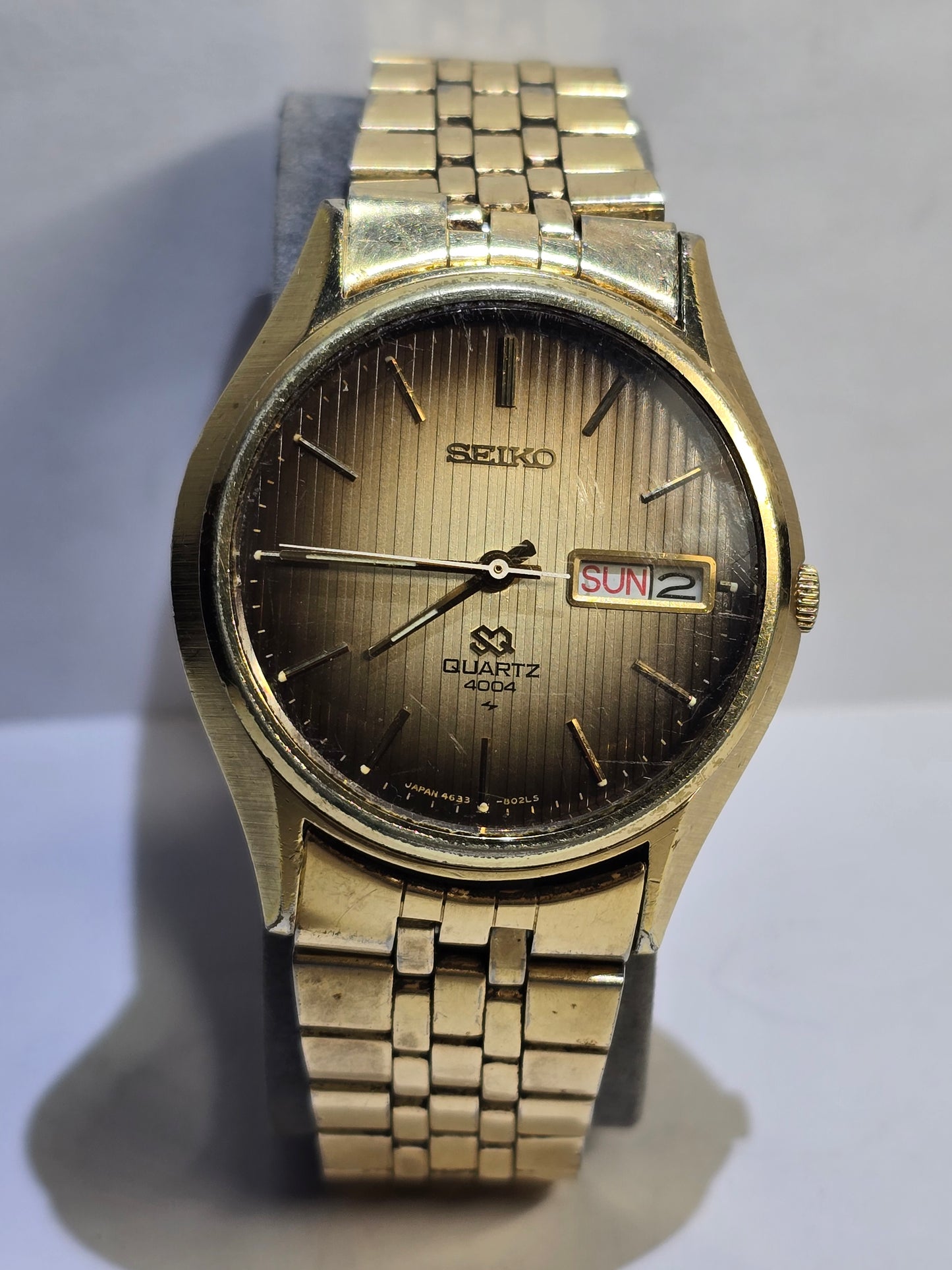 Vintage gold Seiko SQ quartz day date 4004 with original band