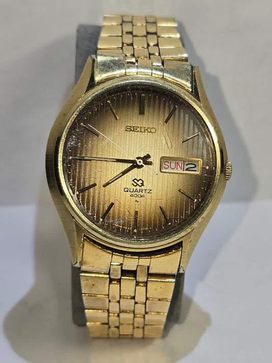 Vintage gold Seiko SQ quartz day date 4004 with original band
