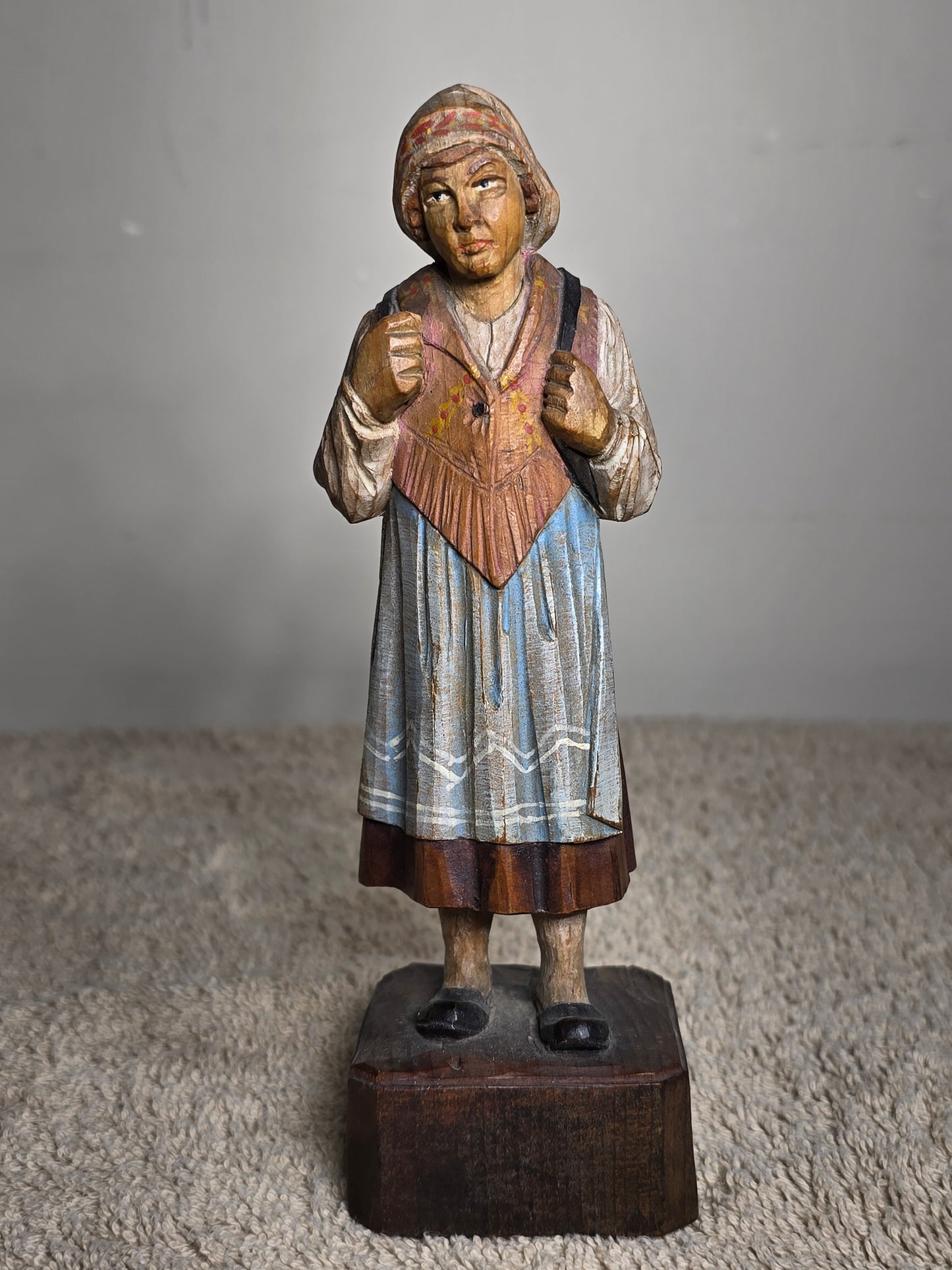 Vintage folk art wood carving of a woman