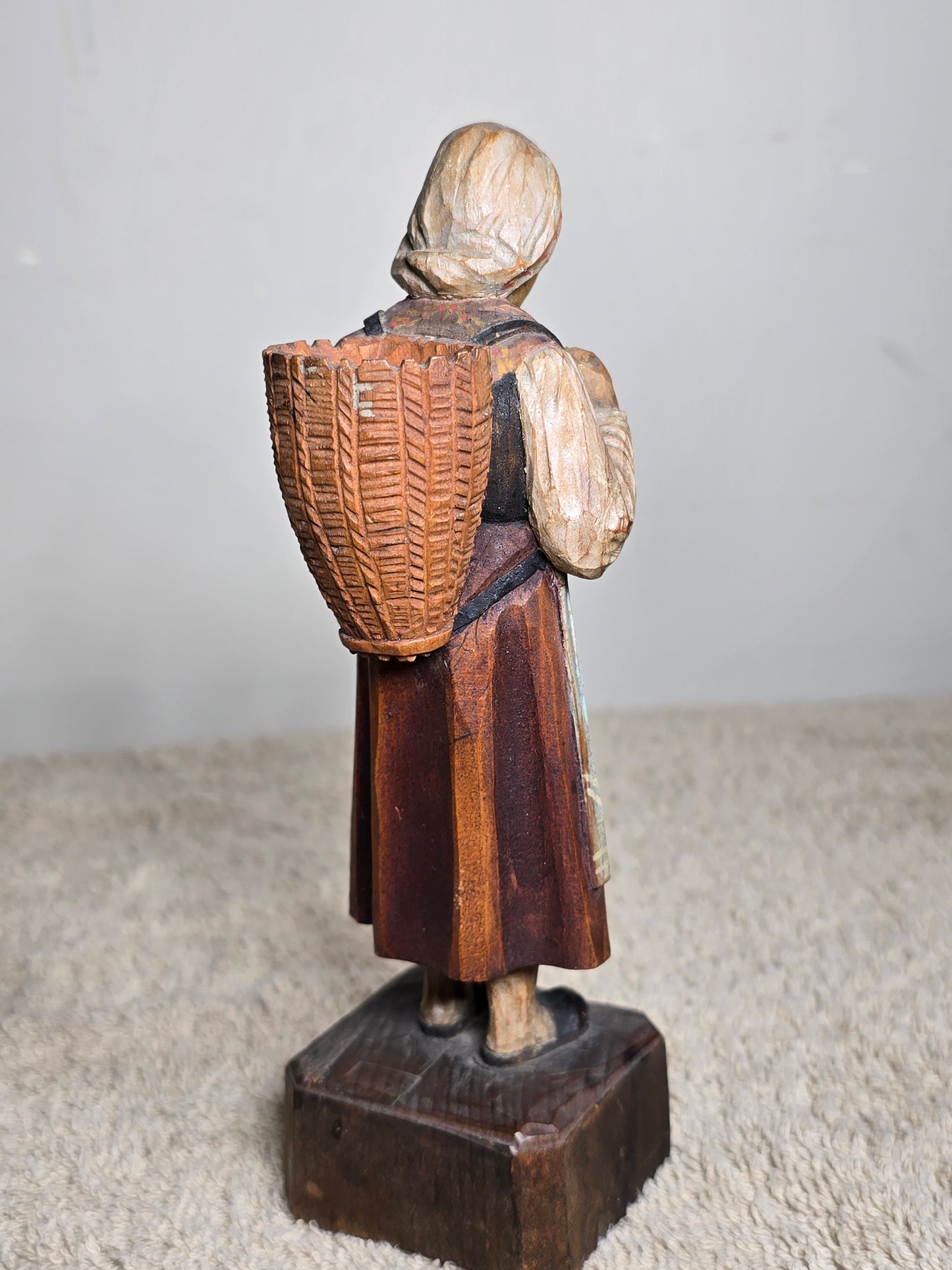Vintage folk art wood carving of a woman