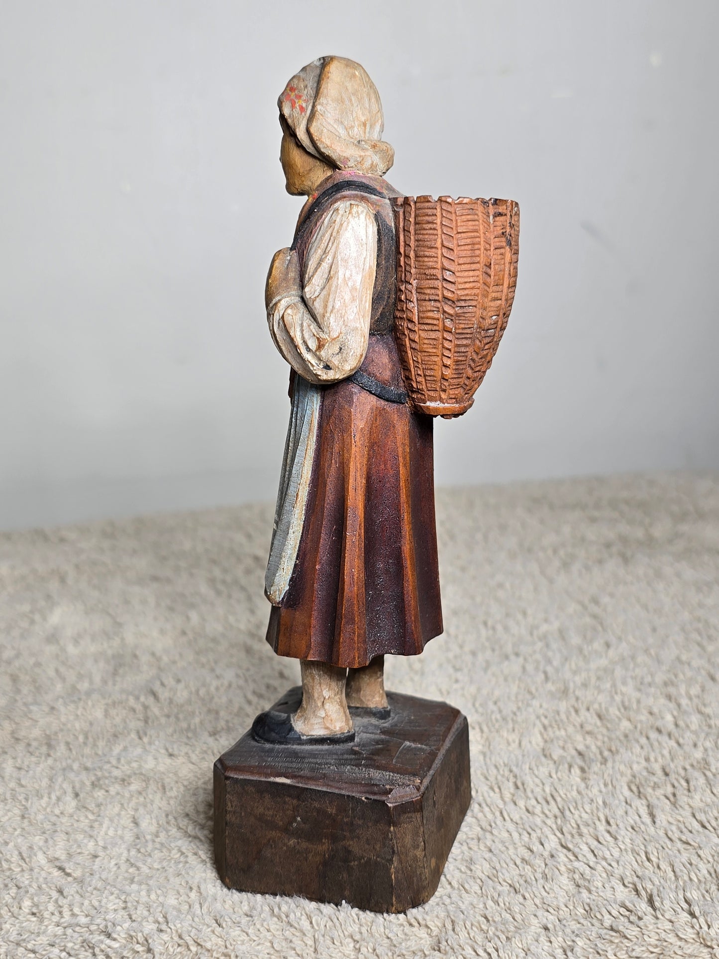 Vintage folk art wood carving of a woman
