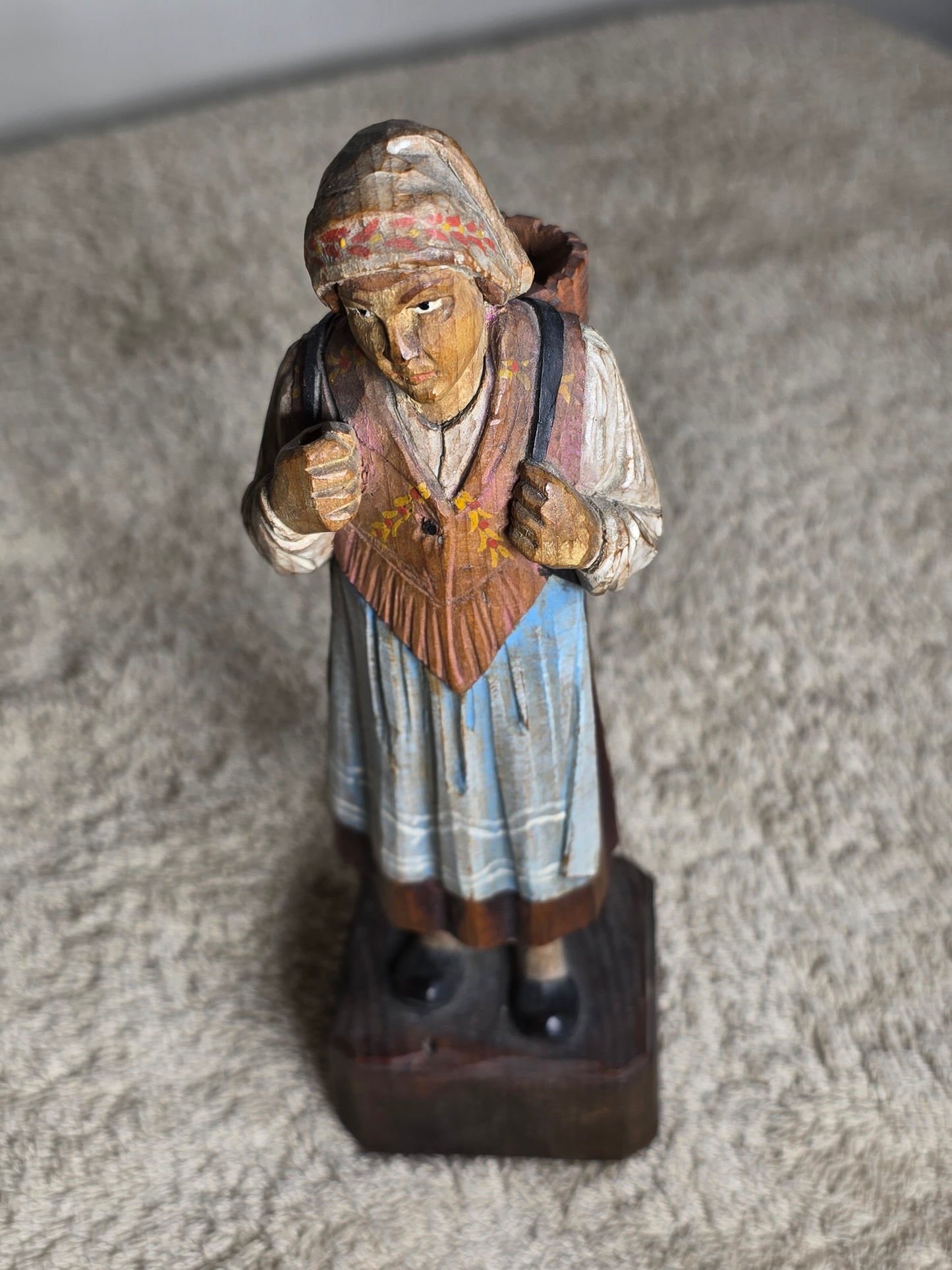 Vintage folk art wood carving of a woman