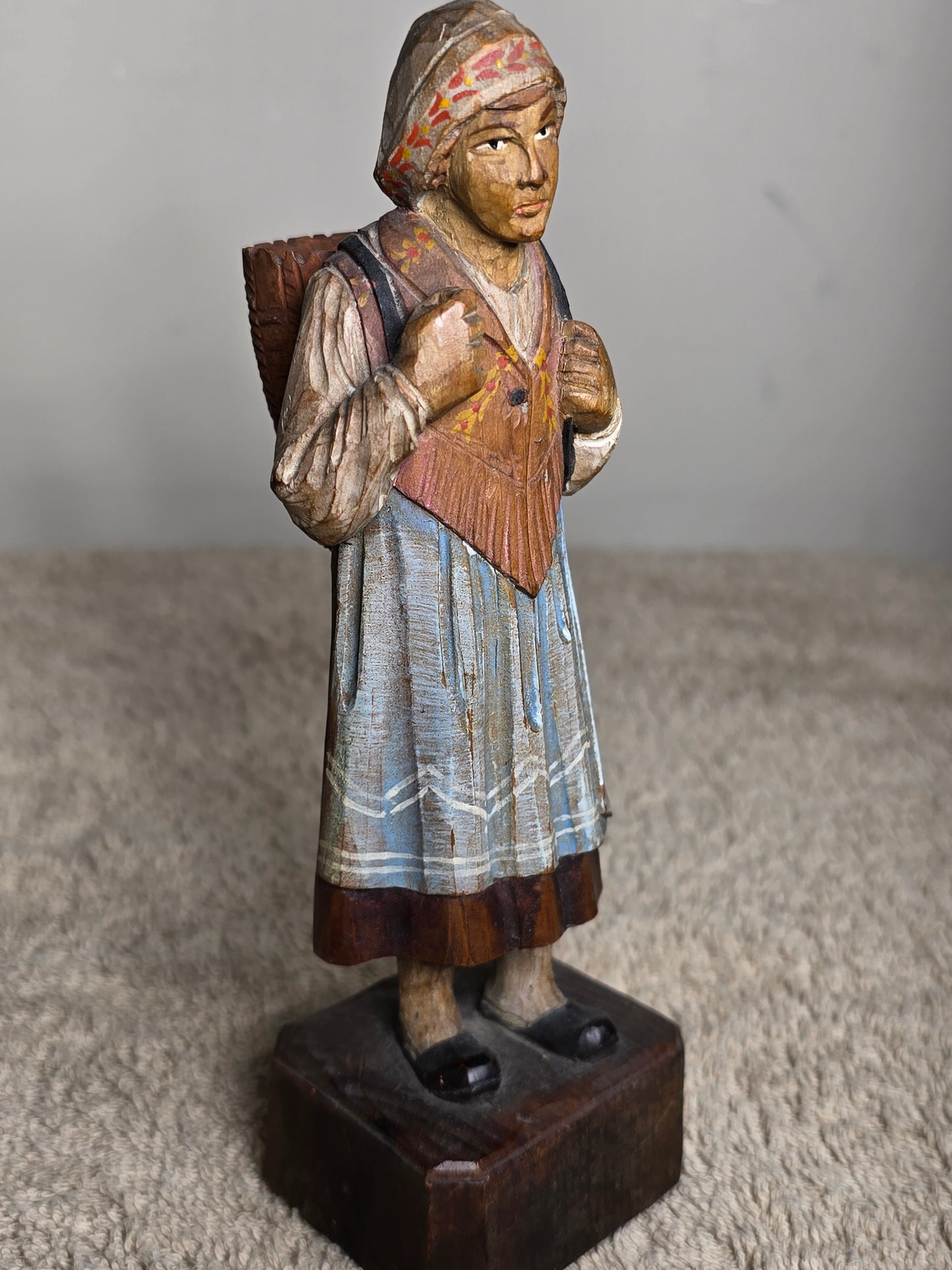 Vintage folk art wood carving of a woman