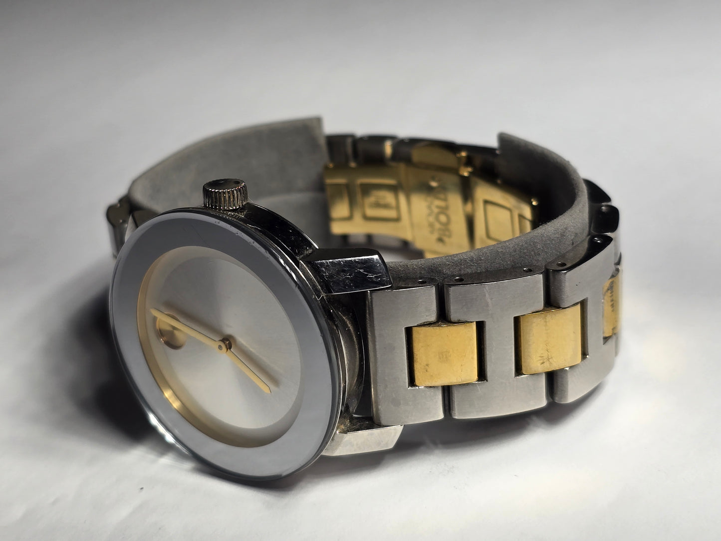 Movado two-tone stainless-steel unisex watch with a silver sunray dial