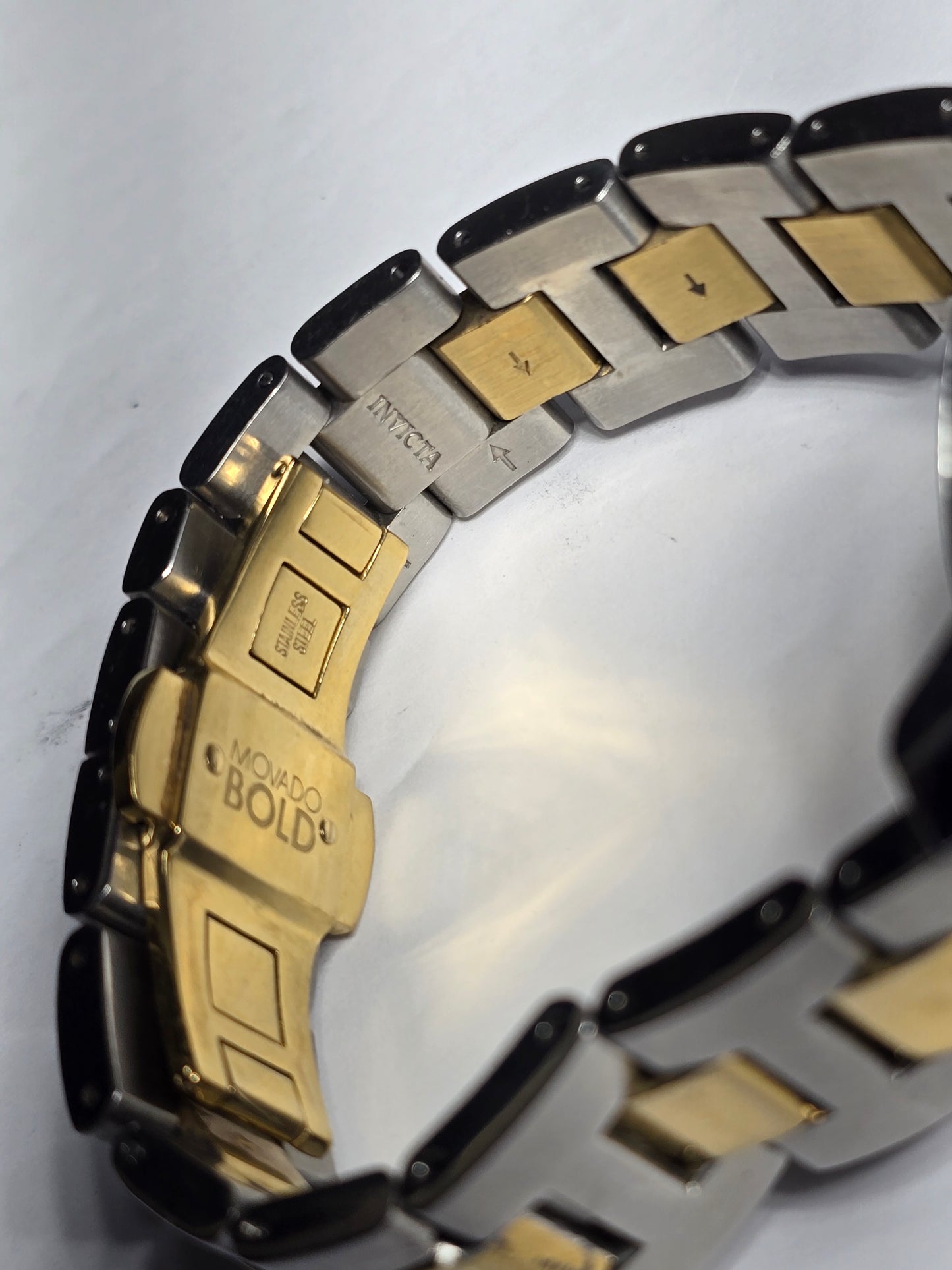 Movado two-tone stainless-steel unisex watch with a silver sunray dial