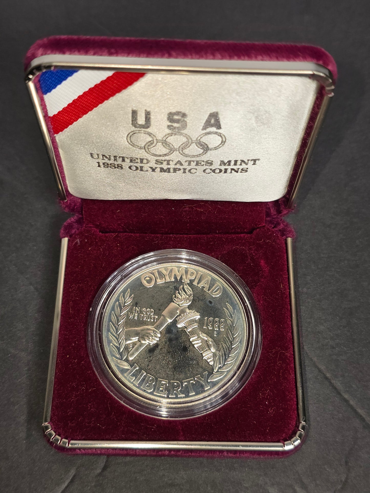 Vintage 1988-S U.S. Olympic Commemorative silver dollar in case