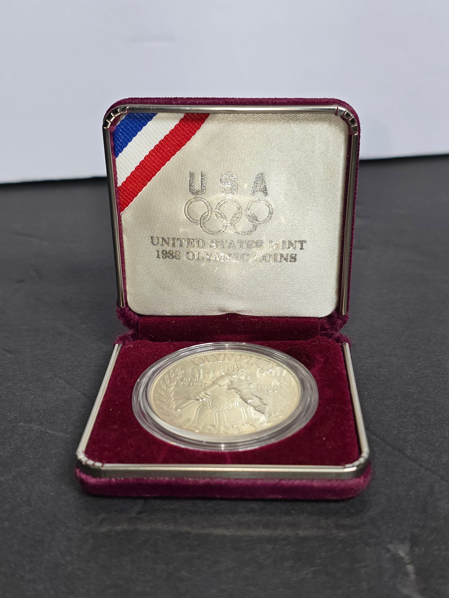 Vintage 1988-S U.S. Olympic Commemorative silver dollar in case